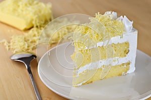 piece of cake with whip cream and grated cheese topping,selective focus
