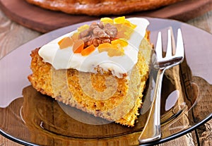 Piece of carrot pie on glass plate
