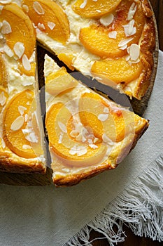 Piece of casserole pie with peaches. Cheesecake