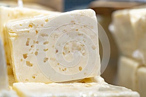 Piece of cheese on display in supermarket