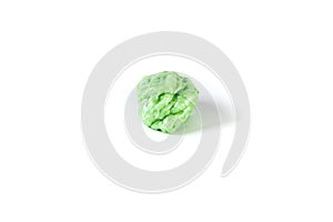 Piece of chewed green bubble gum isolated over white