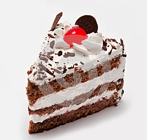 Piece of chocolate cake with cherry isolated