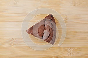 Piece of chocolate cake gateau chocola on cutting board