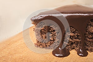 A piece of chocolate pie decorated with hot chocolate closeup