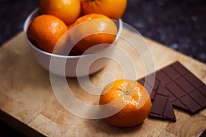 Piece of chocolate with tangerine. An exquisite and perfect blend of the different sweet flavors