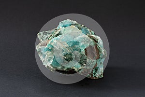 Piece of Chrysocolla mineral with quartz and gypsum, blue turquoise crystals. photo