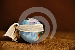 Piece of cloth tied around a terrestrial globe