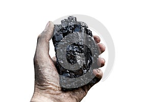 Piece of coal in a raised hand on an isolated white background