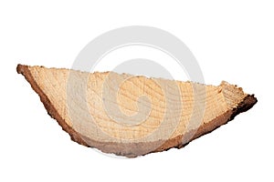 Piece of coniferous wood with visible bark. Material for the manufacture of furniture