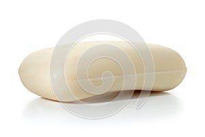 Piece of cream toilet soap on a white background. Full depth of field