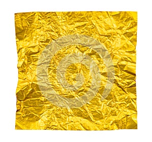 A piece of crumpled yellow foil on a white background. Foil