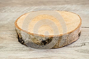 Piece of cut wood on the table. Wooden blockhouse. Close-up.