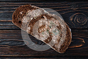 Piece of dark Molded bread photo