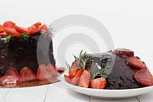 A piece of delicious chocolate cake with strawberries