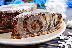 A piece of delicious two-color cake with chocolate and coconut chips.