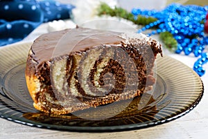 A piece of delicious two-color cake with chocolate and coconut chips