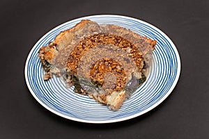 A Piece of Egyptian Spinach Pie with a Dukkah crust topping photo