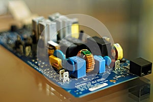 Piece of electronic equipment - various electronic components mounted on PCB - printed circuit board.