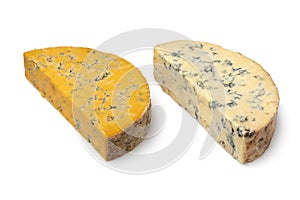 Piece of English Shropshire Blue cheese and a piece of Stilton cheese on white background
