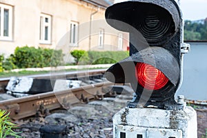 Piece of equipment shining a red light next to the train