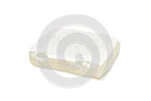 Piece of feta cheese isolated on white