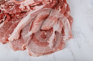 Piece of fresh juicy raw cutting meat in chopping board