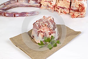 Piece of fresh raw oxtail beef meat on paper