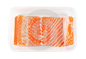 Piece of fresh salmon fillet sliced in plastic box isolated on white background ,include clipping path