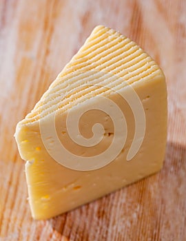 Piece of fresh semi-soft cheese