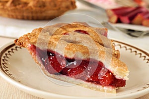 Piece of fresh strawberry and rhubarb pie