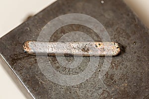 piece of freshly cast and unworked silver. silverware.