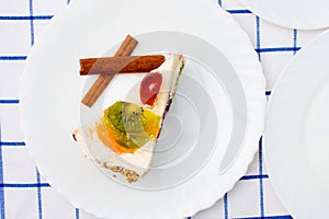 Piece of fruit cake on white plate