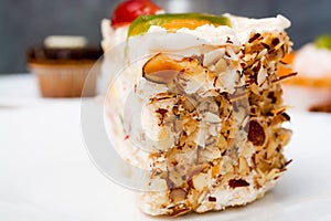 Piece of fruit cake on white plate