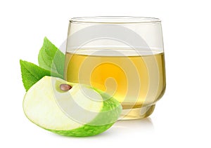 Piece of green apple and glass of juice isolated on white background