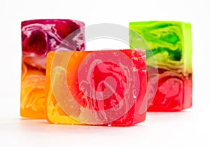 Piece of handmade bright soap. Close-up on a white background