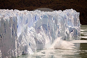 Piece of ice collapses as the Perito Moreno Glacier advances in the Los Glaciares National Park, Patagonia, Argentina