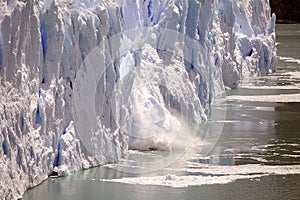 Piece of ice collapses as the Perito Moreno Glacier advances in the Los Glaciares National Park, Patagonia, Argentina