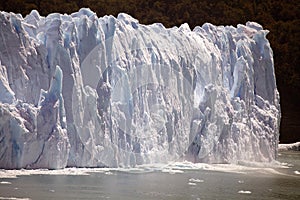 Piece of ice collapses as the Perito Moreno Glacier advances in the Los Glaciares National Park, Patagonia, Argentina