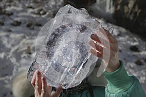Piece of ice in hands