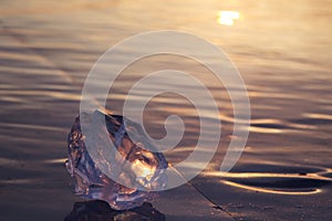 A piece of ice lying on the frozen surface of lake Baikal