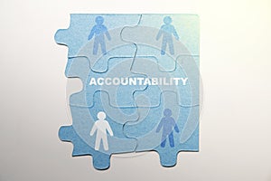 Piece of a jigsaw puzzle with Accountability text and a human figure symbol