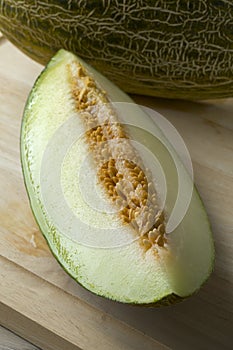 Piece of juicy Piel de sapo melon close up photo