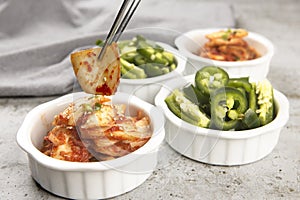 Piece of kimchi in chopsticks
