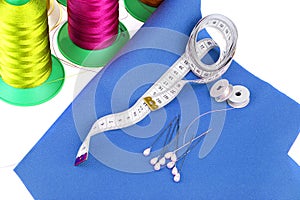 A piece of leatherette with needles and thread. Sewing workshop.