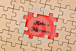 Piece missing from jigsaw puzzle with word Make a Difference