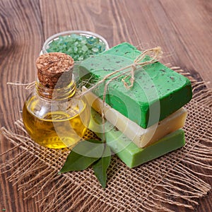 Piece of natural soap with oil and herbs