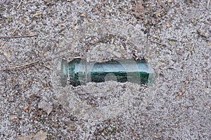 a piece of the neck of a green glass bottle