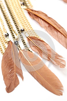 Piece of necklace chains with feathers