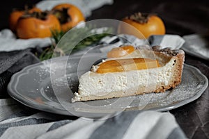 Piece of pie with persimmon on a plate