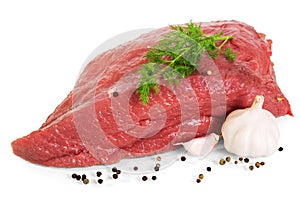 Piece raw beef, spices, garlic and dill isolated on white.